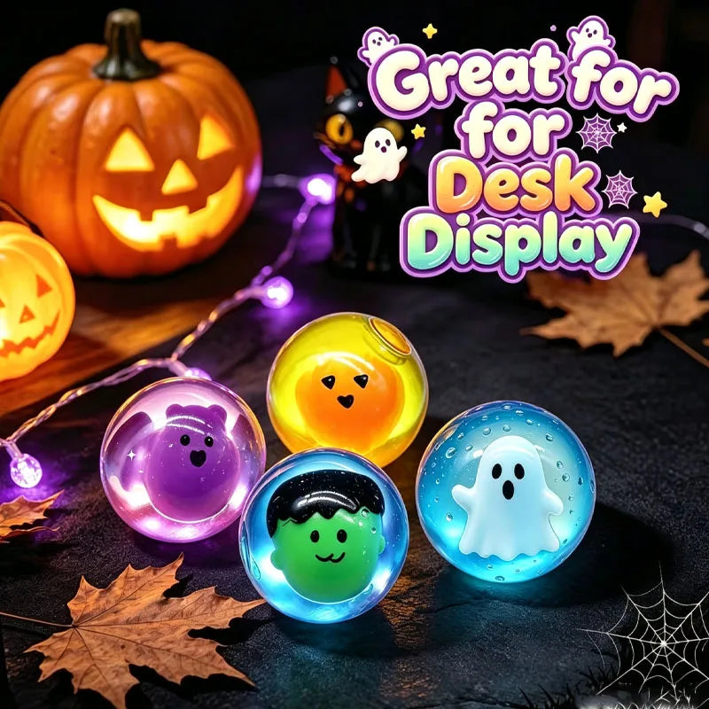 A collection of glowing Halloween-themed squishy toys including a pumpkin, a ghost, and other spooky figures displayed on a d