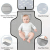 A gray portable diaper changing pad with a removable cover, featuring foam padding and an exquisite design.