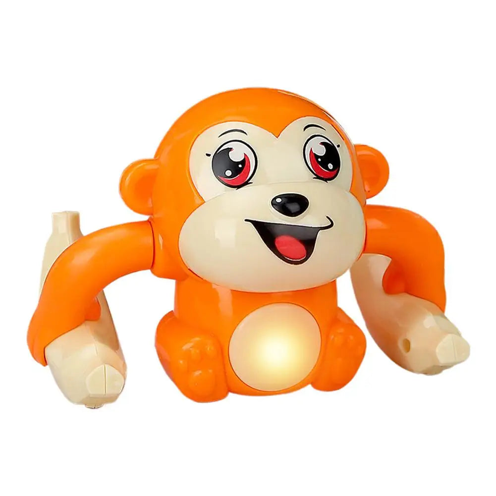 An orange interactive rolling monkey toy with large eyes and a smiling expression.
