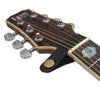 A close-up view of a brown guitar neck with frets and tuning pegs, featuring an inlaid leather strap button and metal fastene