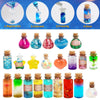 Collection de kits de potions féériques DIY colorés avec diverses liquides dans des bouteilles en verre.