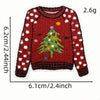 A red knitted sweater with white polka dots and a green Christmas tree design on the front.