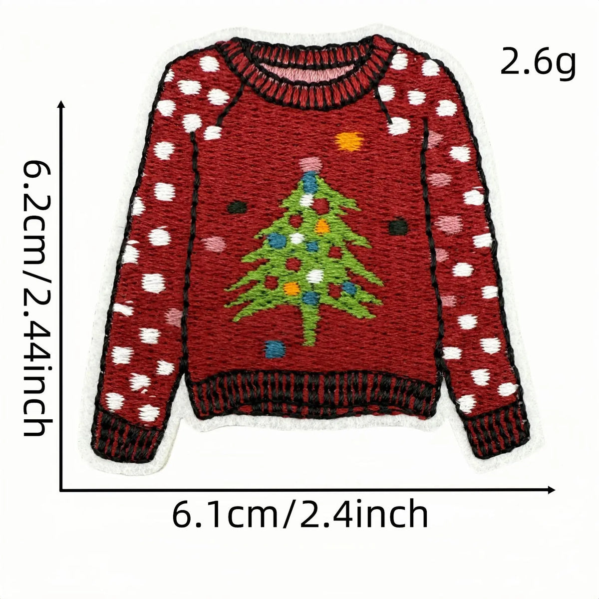 A red knitted sweater with white polka dots and a green Christmas tree design on the front.