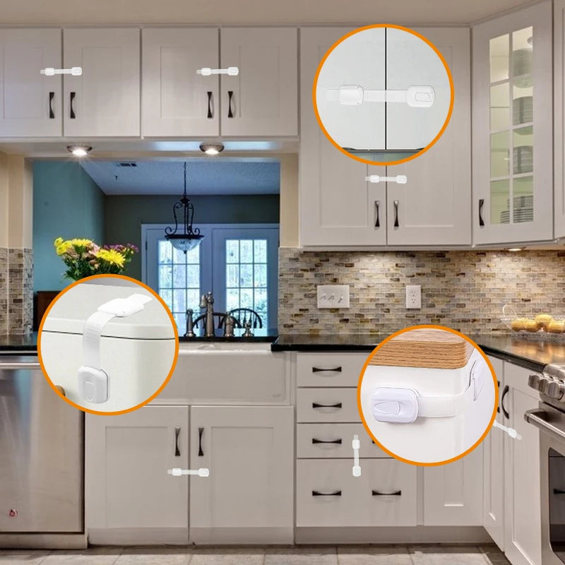 Close-up view of adhesive baby safety locks installed on kitchen cabinets and drawers.