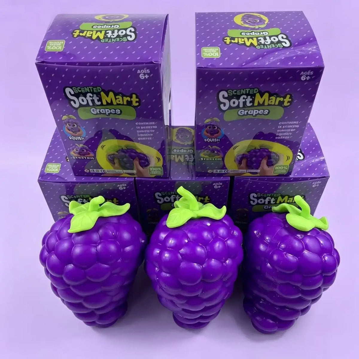 A set of purple scented soft mart grape squishy stress relief toys in boxed and loose form.