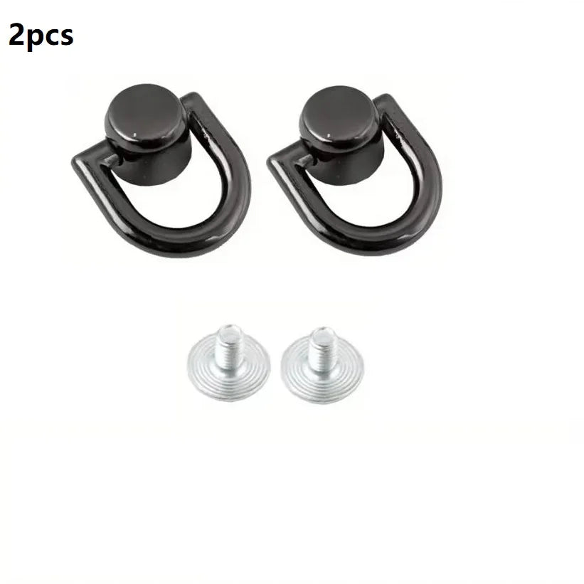 Two black D-shaped metal bag handles with screws for DIY purse straps and craft hardware