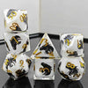 A set of milk white resin dice featuring a black kitten design, arranged on a reflective surface.