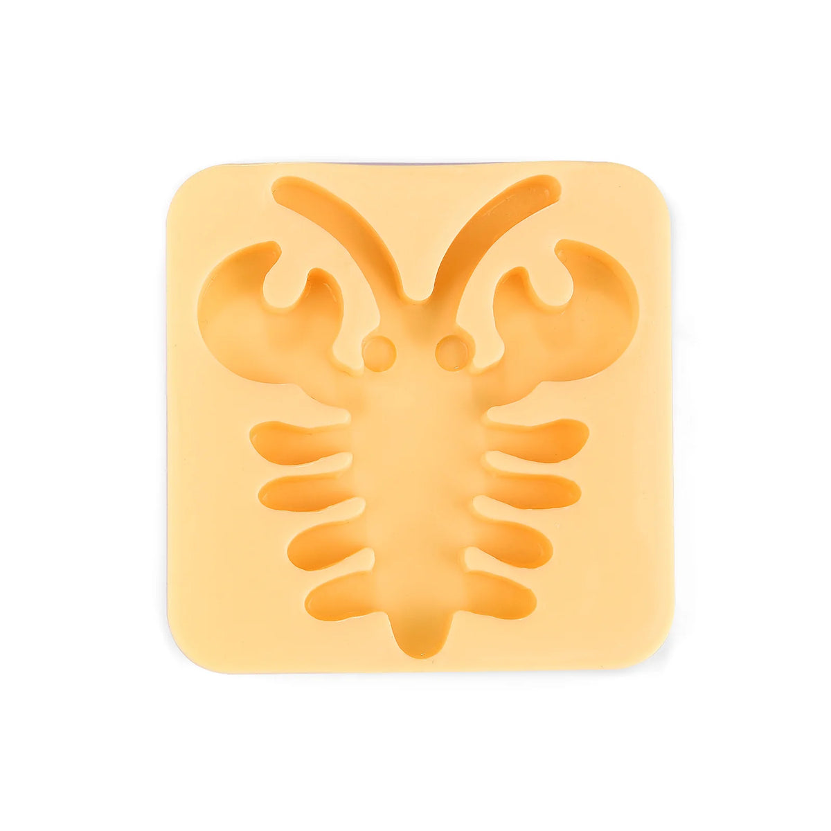 A yellow silicone mold shaped like a stylized elf or creature for DIY craft kits.