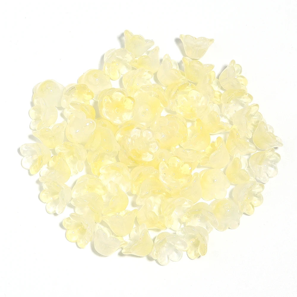 A pile of 50 clear yellow cherry blossom flower glass beads for jewelry making