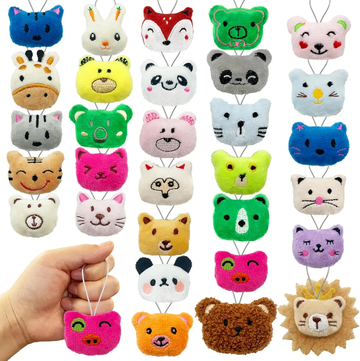 Assorted mini animal plush toys in various colors and shapes with keychain loops