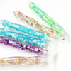 A collection of glow-in-the-dark diamond painting pens with various colorful tips displayed on a white background.