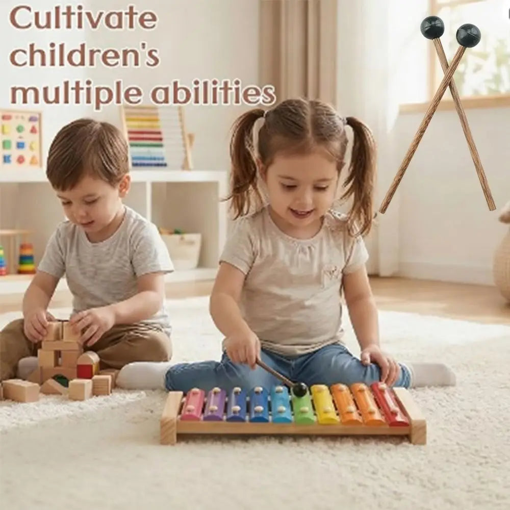 Two wooden handle handpan drum mallets with silicone tips are shown next to a child playing.