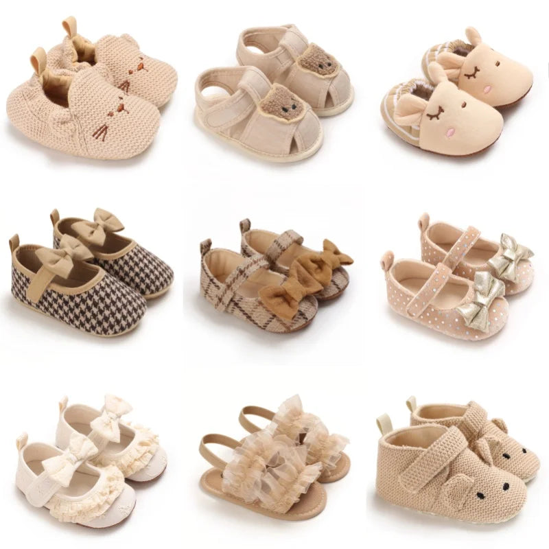 A collection of soft cotton baby walking shoes in beige and tan colors.
