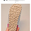 Close-up view of the sole of a light beige slip-on shoe with textured, non-slip tread