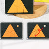 Three wooden geometric puzzles of varying sizes and colors, featuring orange triangles on black backgrounds.