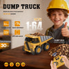 A child is playing with a yellow mini dump truck remote control toy and a pile of wood chips.