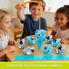 A boy and a girl are playing with an 8-piece set of telescoping shark toys on a wooden table.
