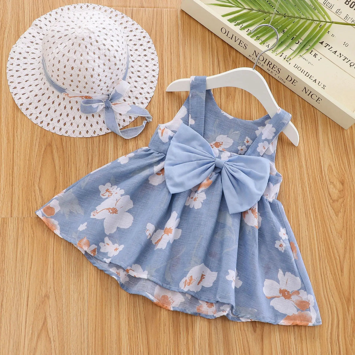 A light blue floral summer dress for a baby girl with ruffled details and a matching straw sunhat.