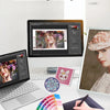 A close-up of a manual adjustment feature for a photo diamond painting kit with various colored beads and tools.