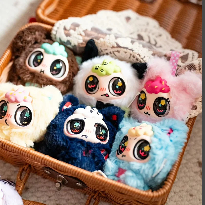 A collection of cute blind box pendants featuring various pastel and dark colored characters.