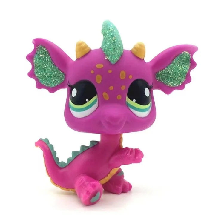 A small, pink Littlest Pet Shop style standing dog figure with green sparkly accents on its head and ears.