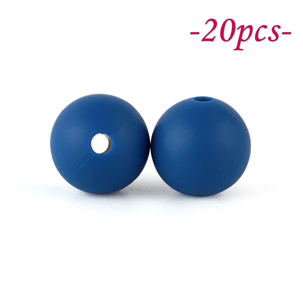 Two round blue silicone beads with a hole, shown against a white background.
