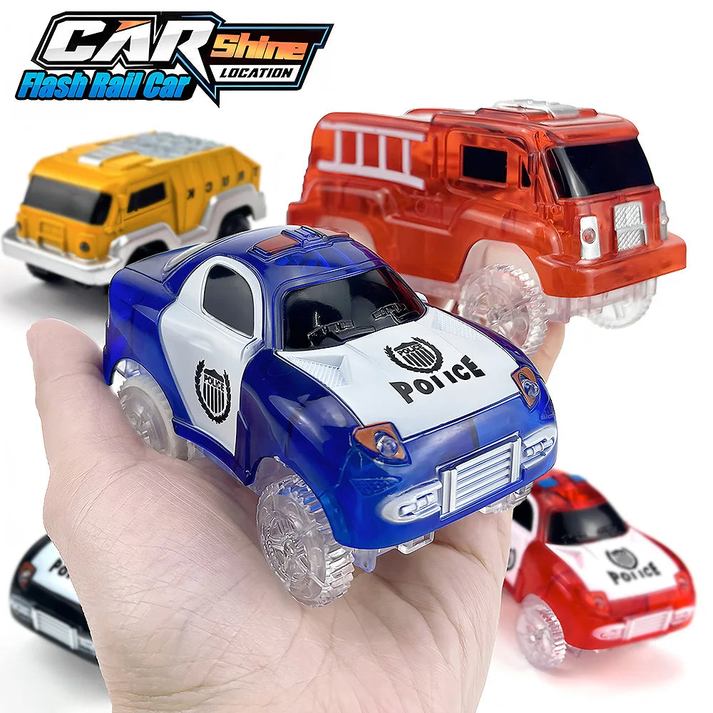 A hand holds a collection of LED glowing race cars, including a blue police car and orange jeep.
