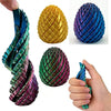 Colorful 3D printed dragon egg fidget spinners in various shades of yellow, purple, and green.