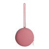 A pink silicone pacifier holder with a long strap and a circular soother case.