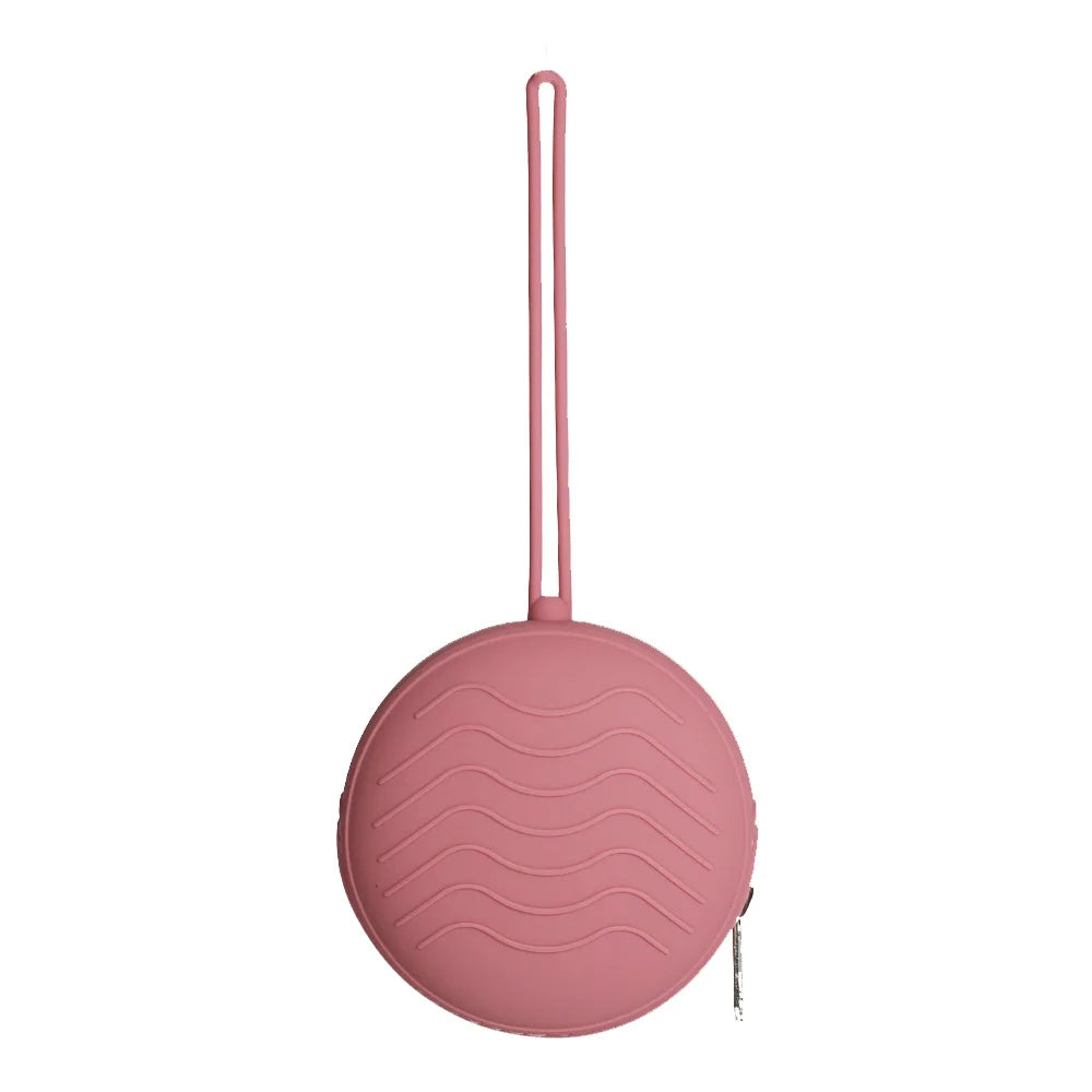 A pink silicone pacifier holder with a long strap and a circular soother case.