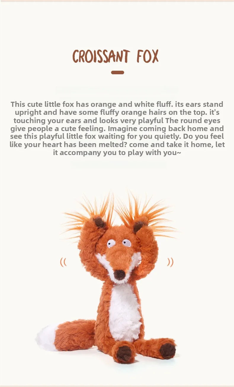 An orange and white fox plushie with fluffy fur sitting upright.