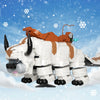 A white and orange flying bison model built from LEGO bricks against a snowy blue background.