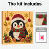A kit for pearl diamond painting featuring a penguin in a Santa hat, including various beads and drilling accessories.