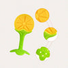 A soft silicone fruit-shaped baby teether in yellow and green, shown with various parts.
