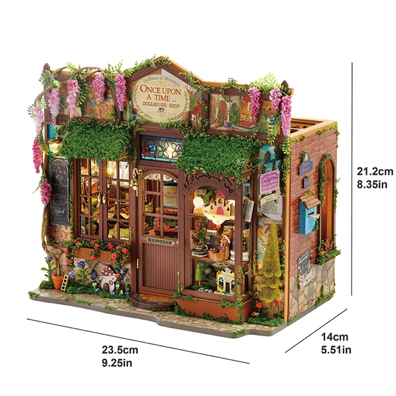 A detailed miniature dollhouse kit featuring a wooden facade, greenery, and decorative elements.