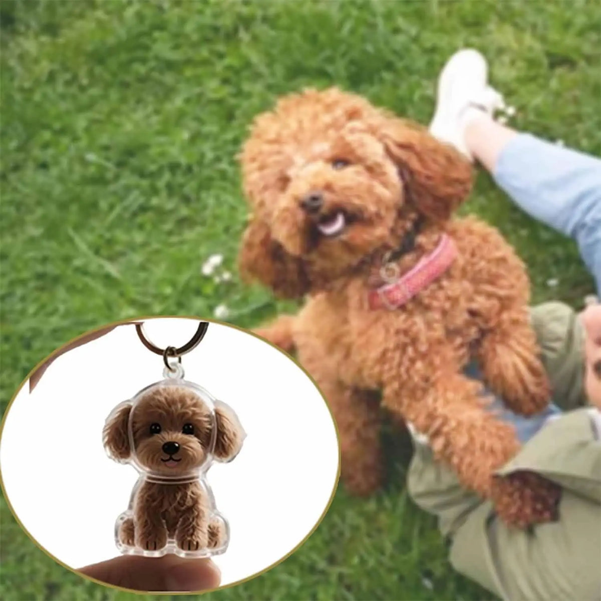 A small, dog-shaped pet hair keepsake keychain is shown next to a person's hand outdoors.