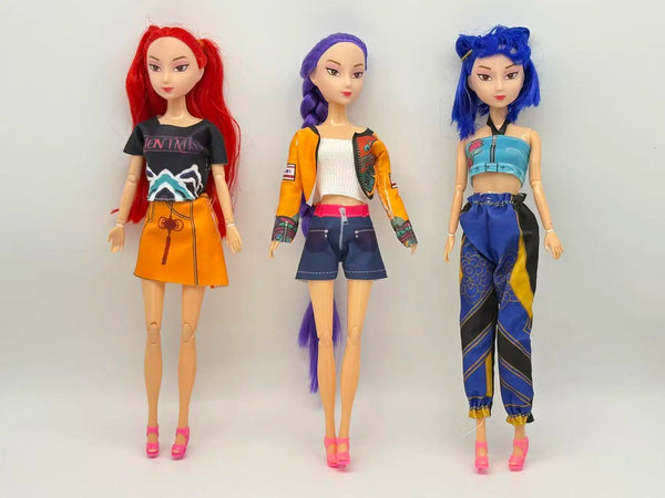 Three fashion dolls with interchangeable outfits featuring red, purple, and blue hair.