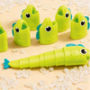Bright lime green stretchable fishing board game toys with fish shapes scattered on a light background