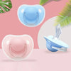 A set of two silicone pacifiers with protective covers in light blue and pink tones shown against a soft background.