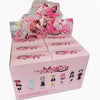 A pink box containing an articulated vinyl art figure of a character with pink hair and cat ears.