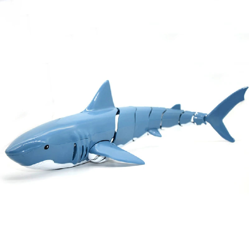 A blue remote control shark toy with light and water spray.