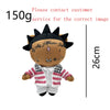 A plush doll resembling Eminem, XXXTentacion, and Frank Ocean with a dark face and a patriotic striped jacket.