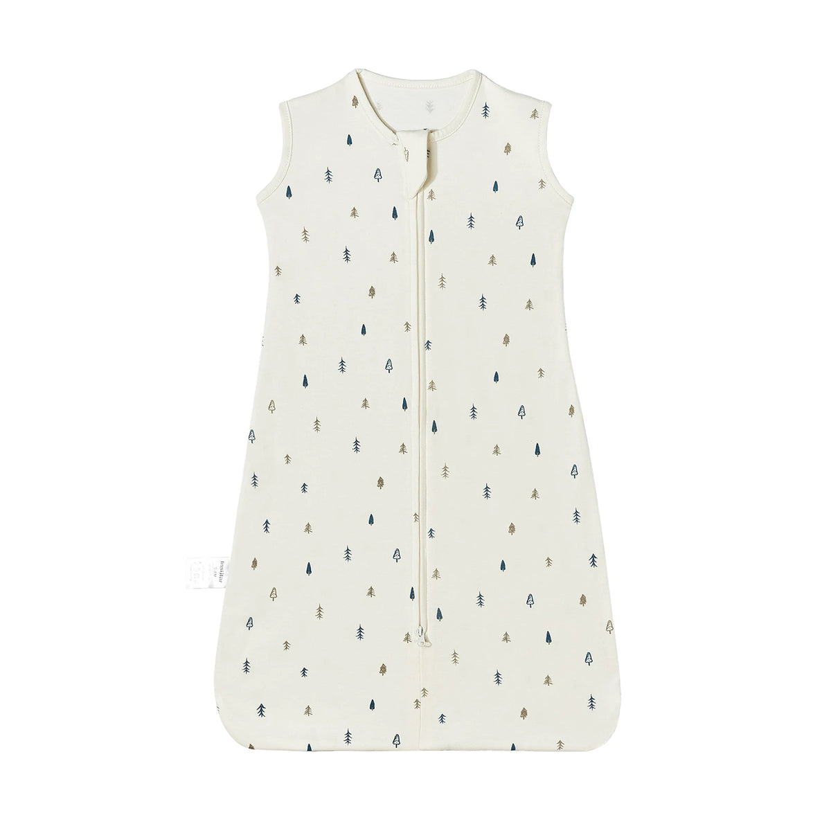 A cream colored sleeveless baby sleeping bag with a vertical zipper decorated with small evergreen trees.