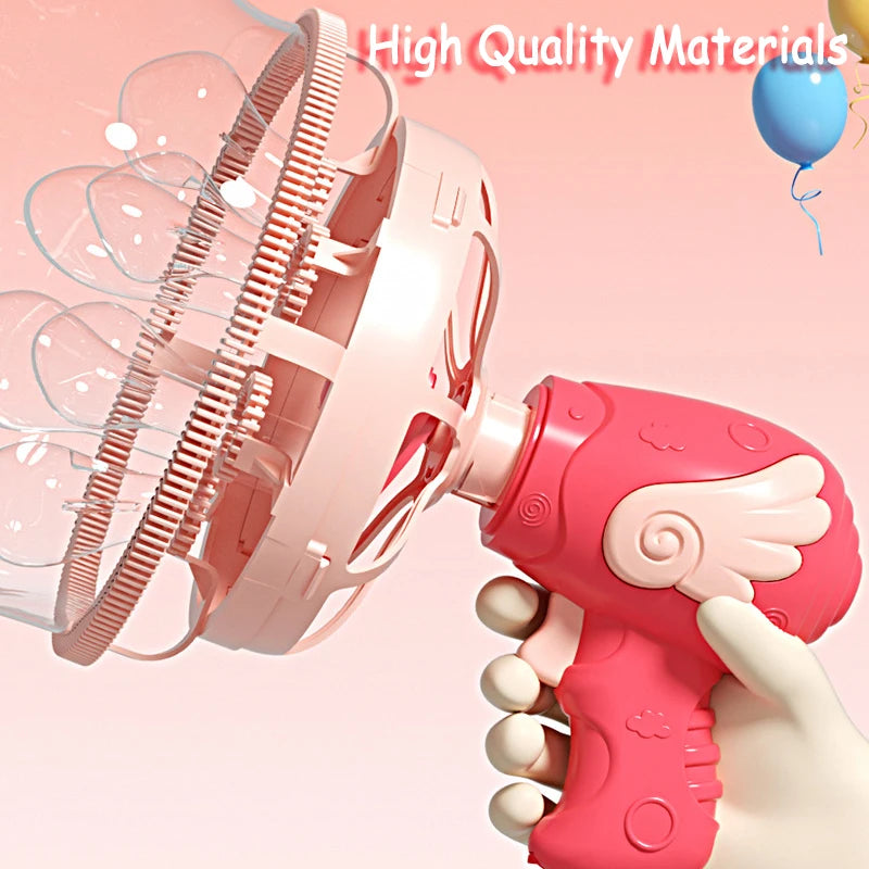 A pink electric bubble machine is shown being held by a hand, with bubbles being blown out.