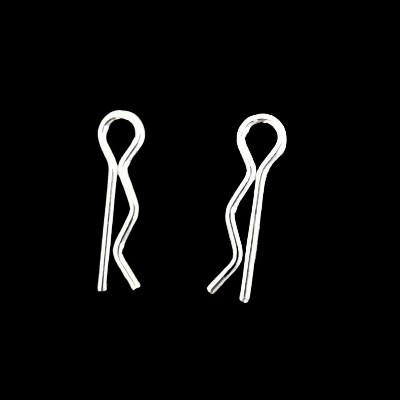 A pair of silver metal hooks or clasps for an RC airplane replacement parts kit.