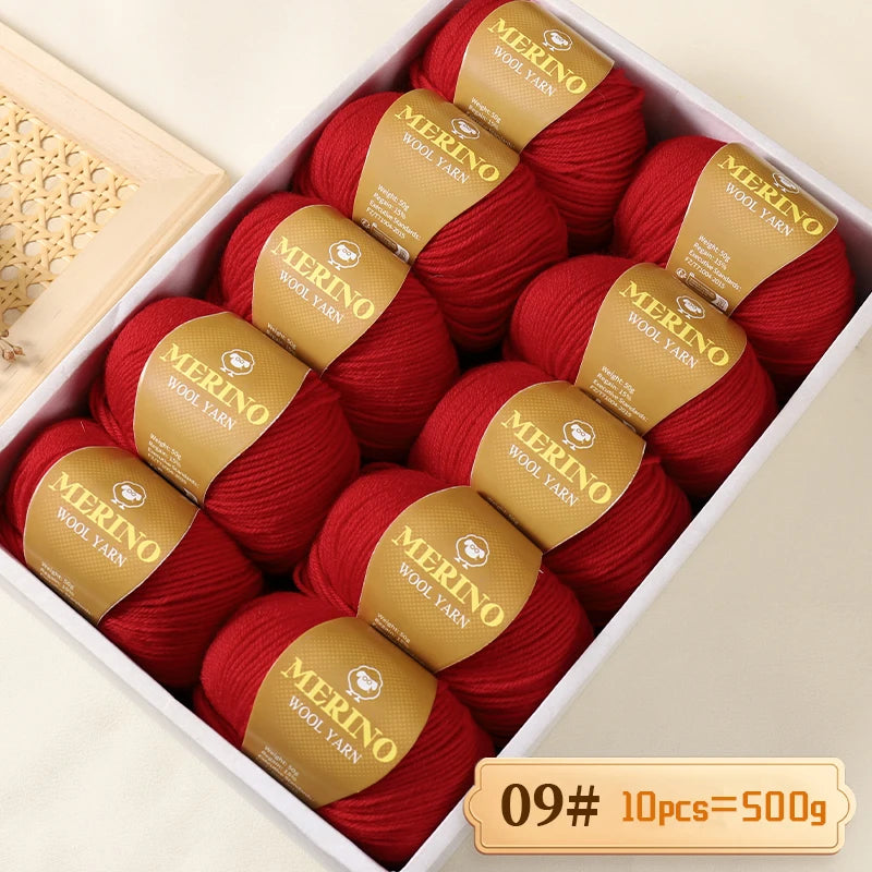 A box filled with red merino wool yarn balls, labeled Merino Wool Yarn, ready for knitting projects.