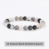 A stretch bracelet made of 3A natural black rutilated quartz beads.