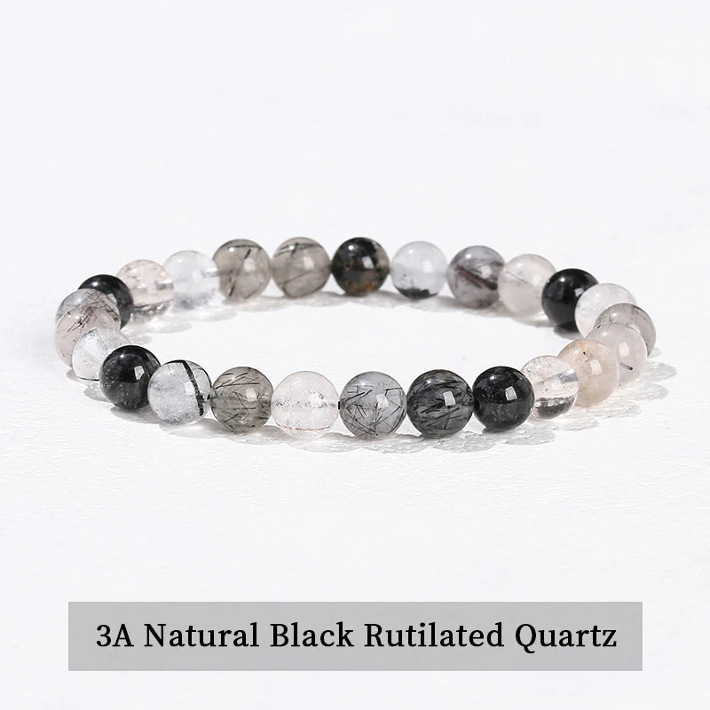 A stretch bracelet made of 3A natural black rutilated quartz beads.