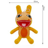 A yellow and orange plush toy resembling a cartoon animal with large eyes and a wide mouth.