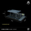 A detailed 1:64 scale mini garage diorama featuring a rooftop structure and parking area for diecast cars.